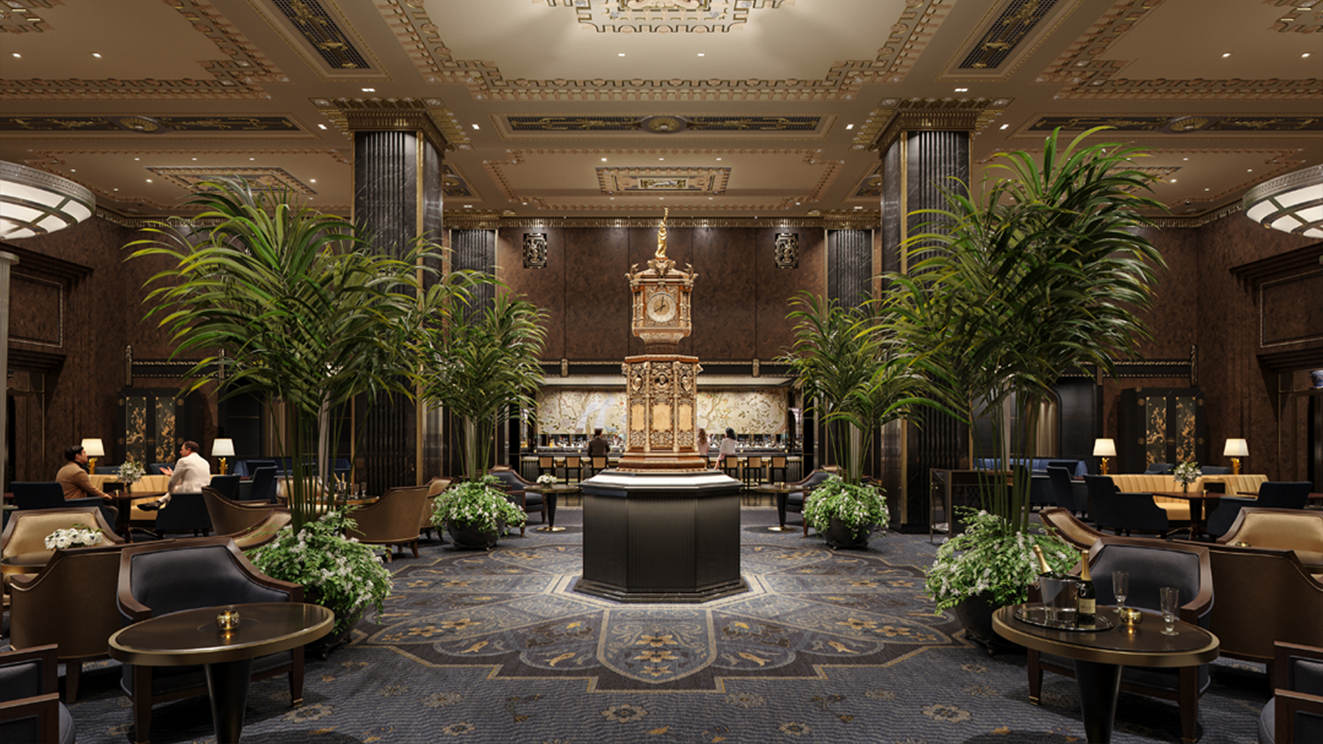 Elegant hotel lobby with ornate ceiling, tall columns, and lush green plants showcases true hospitality. A large gold clock serves as the centerpiece while people relax on dark chairs around small tables, creating a luxurious and inviting atmosphere.