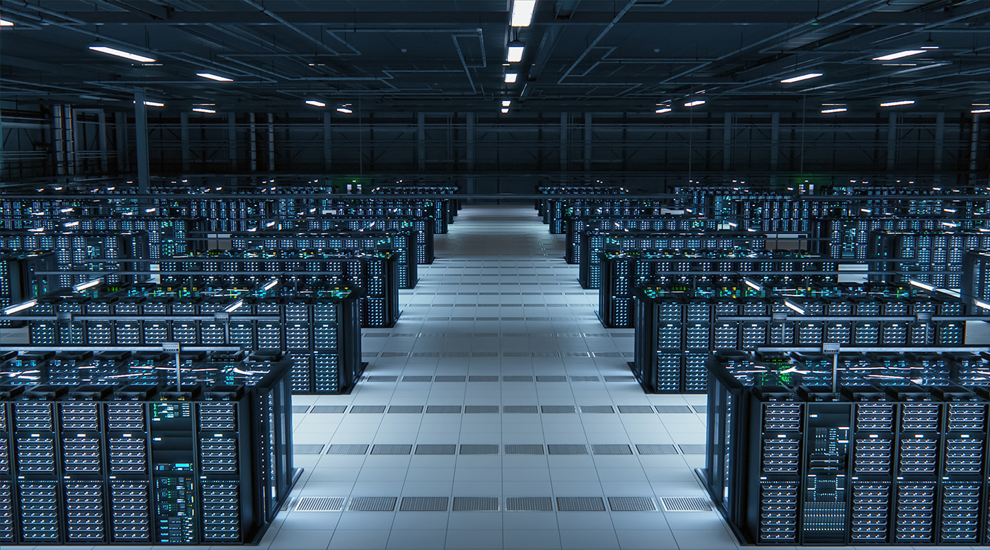 A large, modern data center filled with rows of illuminated server racks arranged neatly across a clean, tiled floor under bright overhead lights.