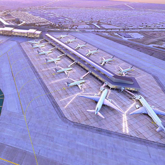 Aerial view of a large airport terminal with multiple airplanes parked at gates, surrounded by runways and taxiways, with a vast parking area and desert landscape in the background.