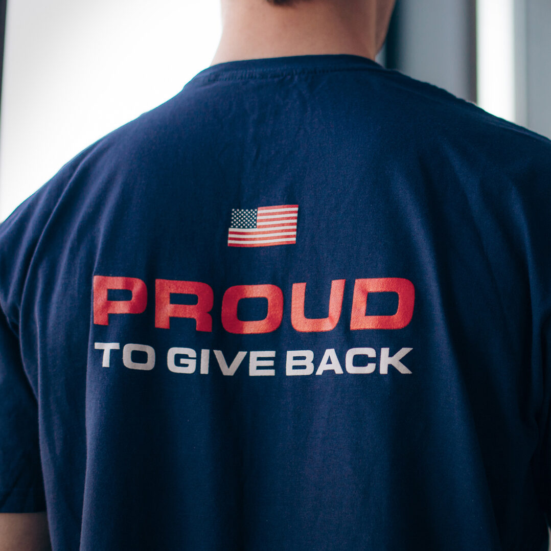 Suffolk t-shirt reads 'Proud to give back'