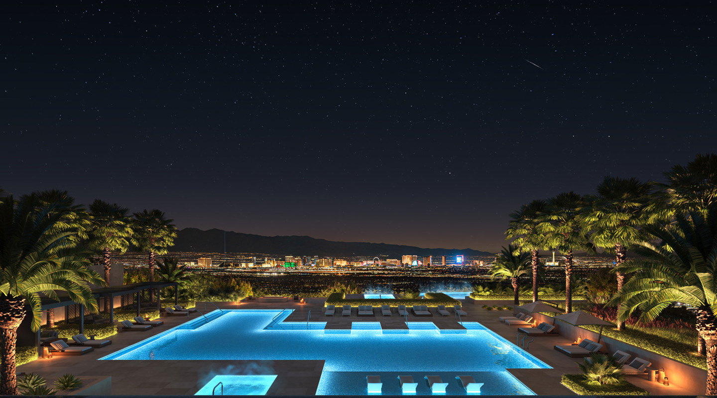 A luxurious outdoor swimming pool illuminated at night, surrounded by palm trees, with city lights and a starry sky in the background. Lounge chairs line the poolside, creating a relaxing and upscale atmosphere.