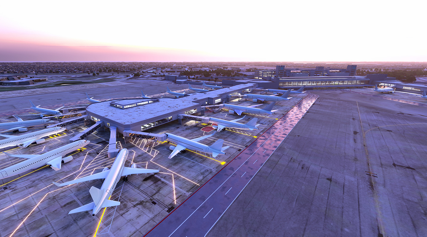 Aerial view of an airport terminal at sunset with several airplanes parked at gates, jet bridges extending to the planes, and the runway and airport buildings visible in the background.