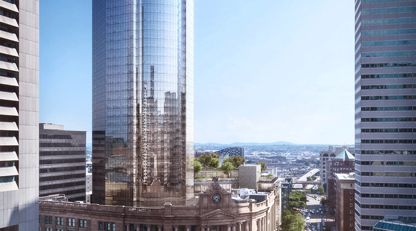 A tall, glass skyscraper reflects nearby buildings and stands behind a historic older building with a clock tower, surrounded by other modern high-rises under a clear blue sky.