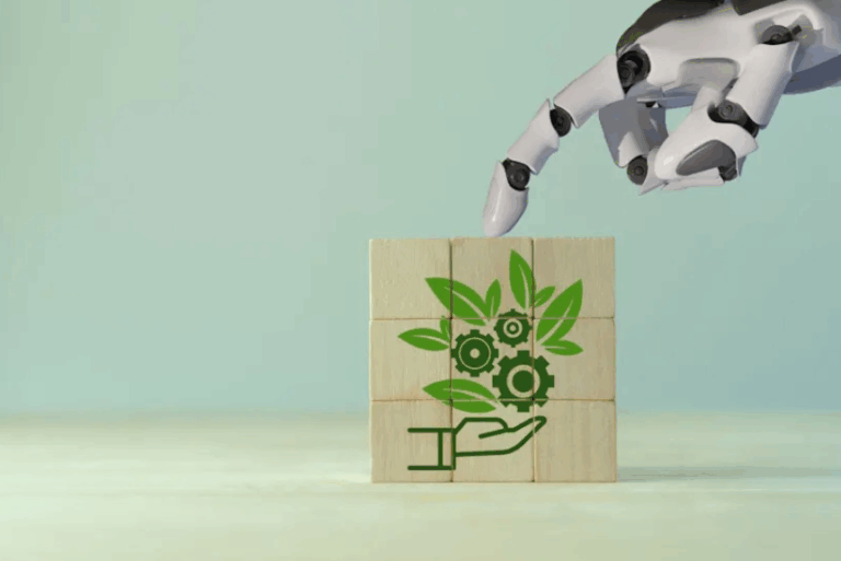 A robotic hand is reaching toward wooden blocks featuring a green illustration of a hand holding leaves and gears, symbolizing the intersection of technology and environmental sustainability.