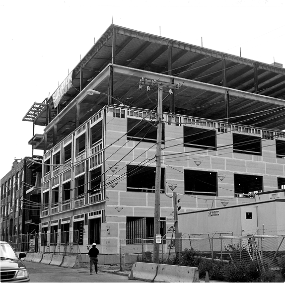 black and white photo of building under construction in boston