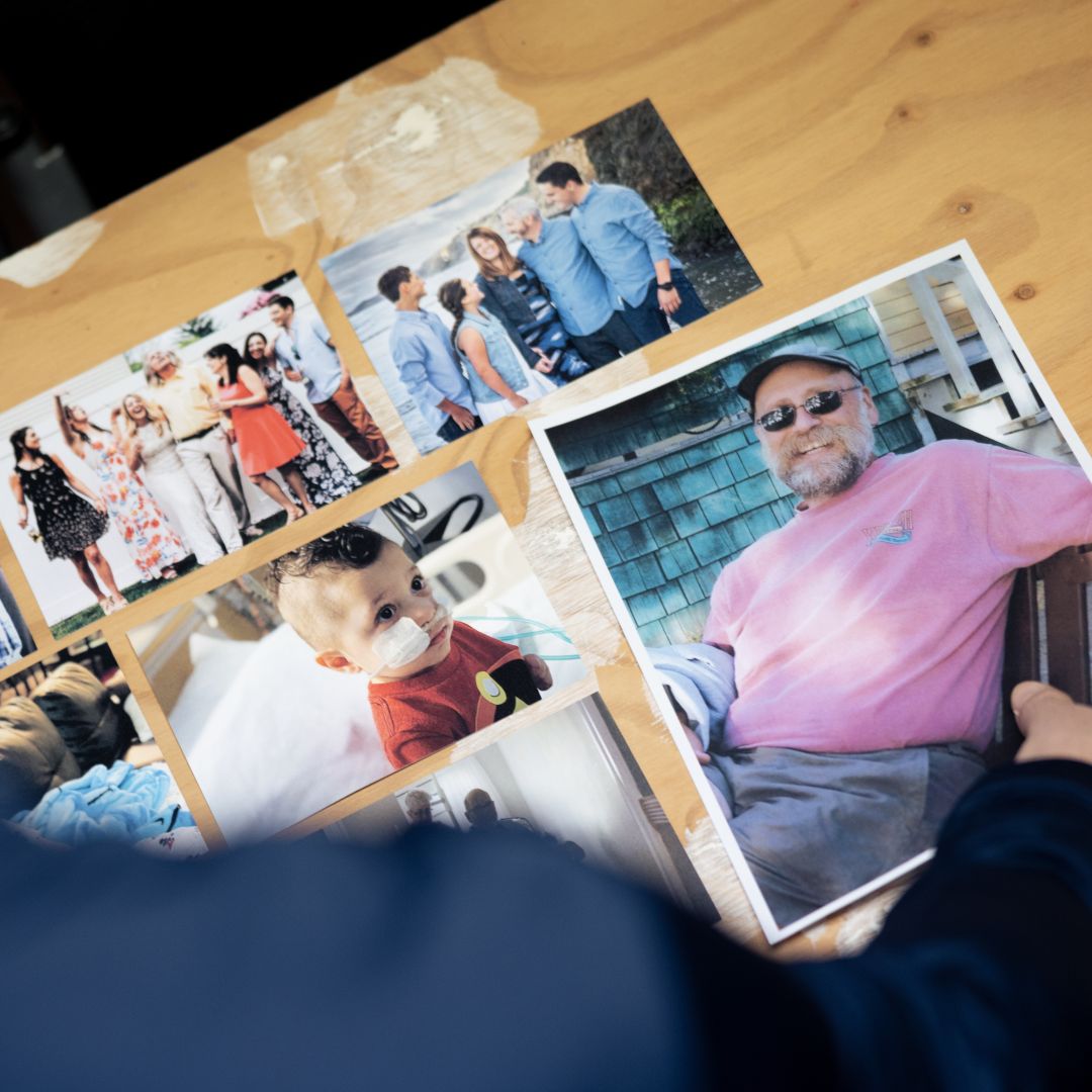 top down view of a desk with images of people in the community