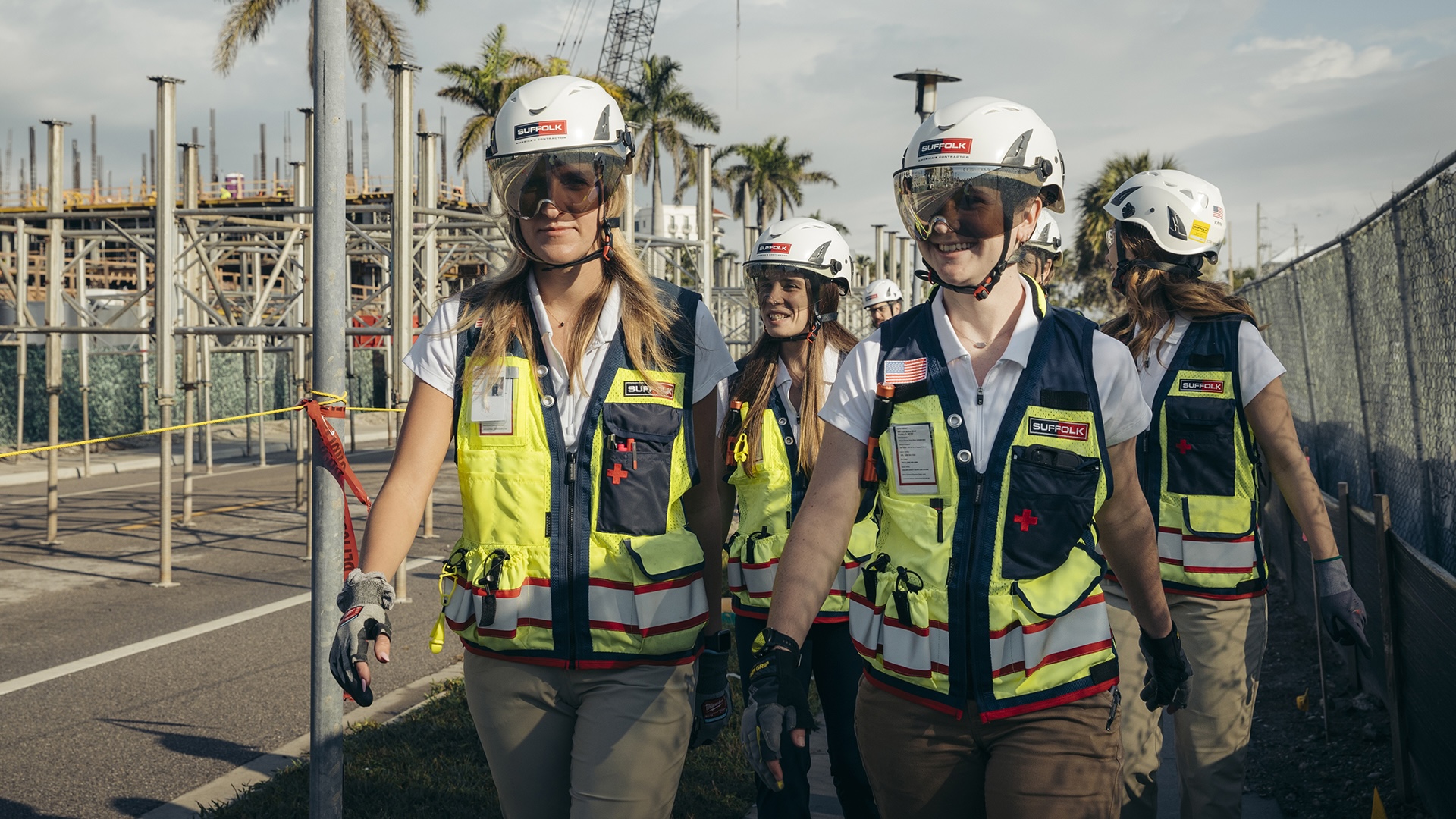 suffolk workers in full safety gear walking on a job site