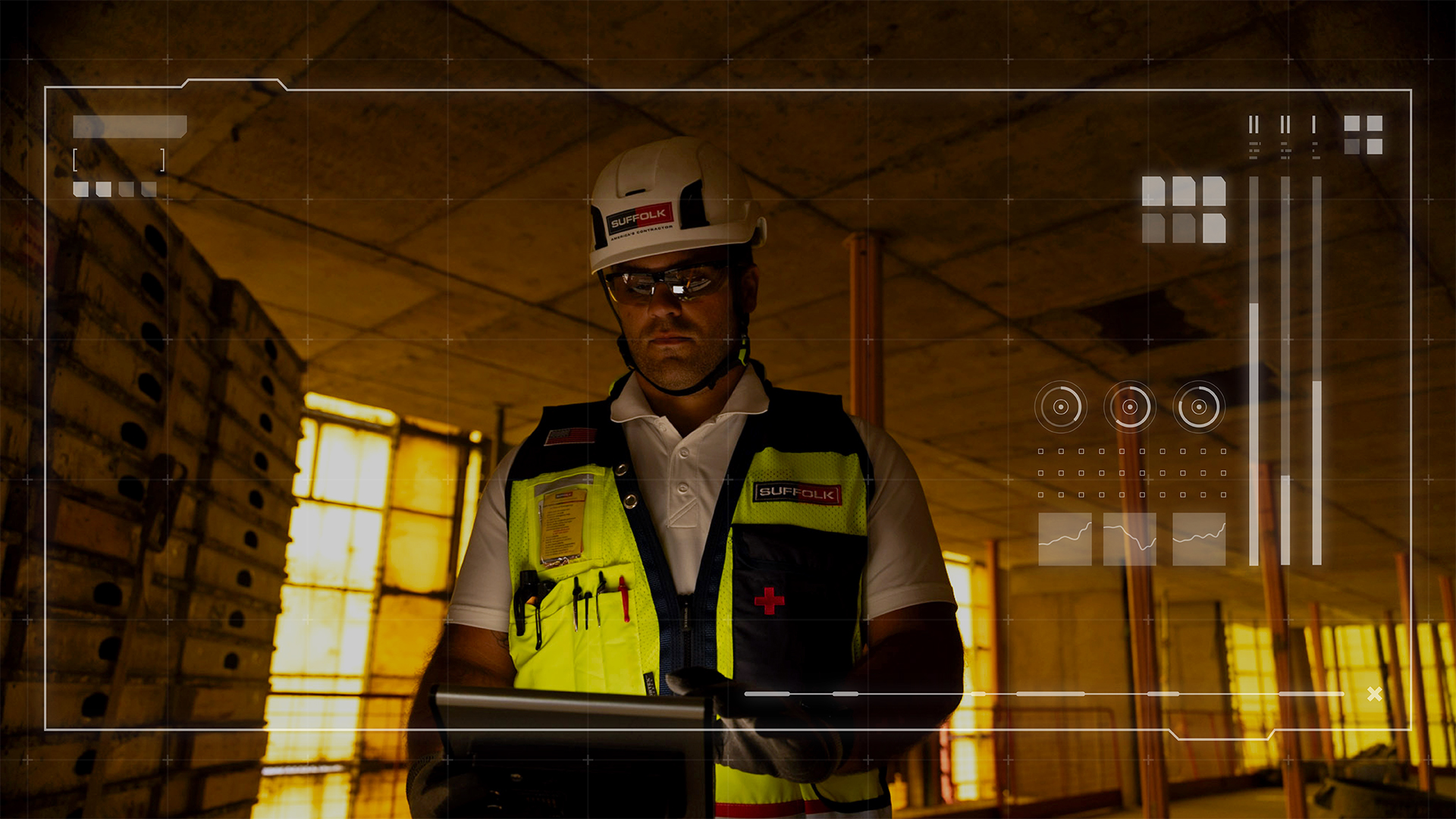 A construction worker wearing a helmet and safety vest stands indoors, using a tablet. Digital interface graphics overlay the image, displaying charts, graphs, and data elements. The background shows a partially built structure.